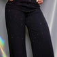 GLOW NOIR — JEAN WIDE LEG CON BRILLOS